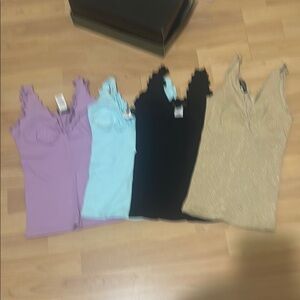 Bebe Camisoles in Purple, Light Blue, Black, and Gold